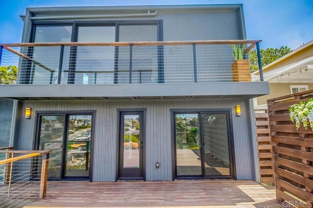 936 Bangor St, San Diego, CA 92106 - back of property with a balcony and a wooden deck