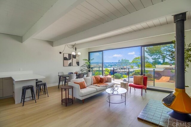 936 Bangor St, San Diego, CA 92106 - living room featuring beamed ceiling, light wood finished floors, and baseboards