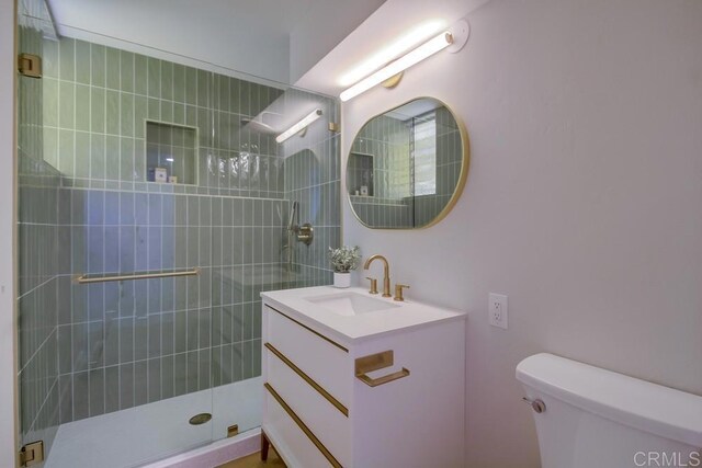 936 Bangor St, San Diego, CA 92106 - bathroom featuring a tile shower, toilet, and vanity
