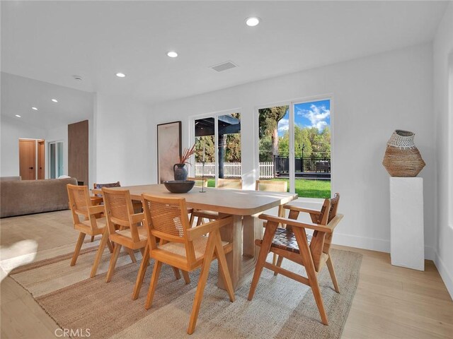 dining area with recessed lighting, baseboards, visible vents, and light wood-style flooring