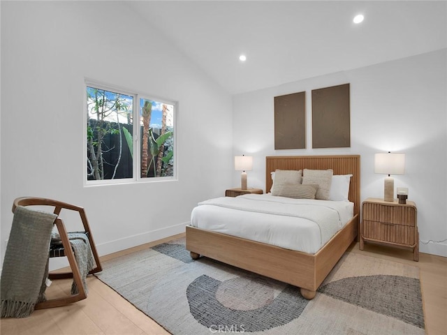 bedroom with recessed lighting, baseboards, and vaulted ceiling