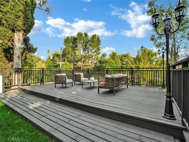 wooden deck featuring an outdoor hangout area