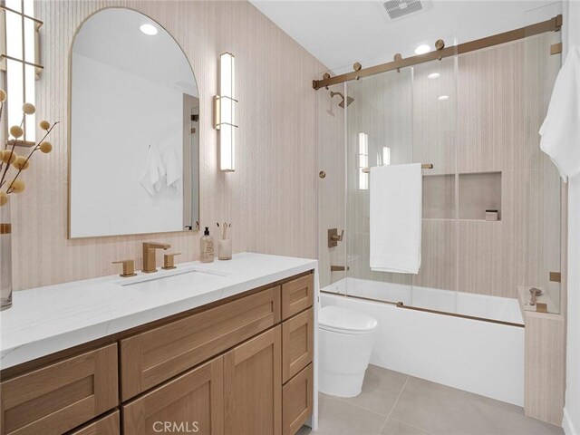 bathroom with tile patterned floors, combined bath / shower with glass door, wallpapered walls, and visible vents