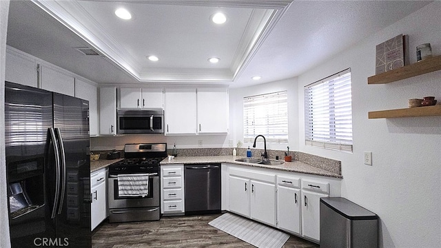 1921 Glenoaks Blvd Unit 196, San Fernando, CA 91340 - kitchen with stainless steel appliances, a raised ceiling, crown molding, dark wood finished floors, and white cabinetry