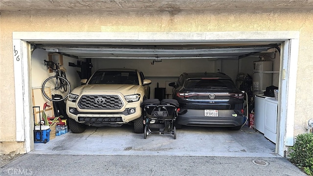 1921 Glenoaks Blvd Unit 196, San Fernando, CA 91340 - garage featuring secured water heater and washer and dryer