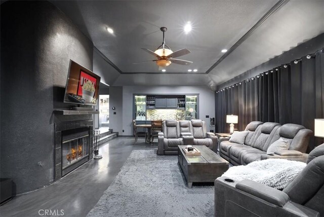 13784 Choco Rd, Apple Valley, CA 92307 - living room with concrete floors, a ceiling fan, recessed lighting, and a glass covered fireplace