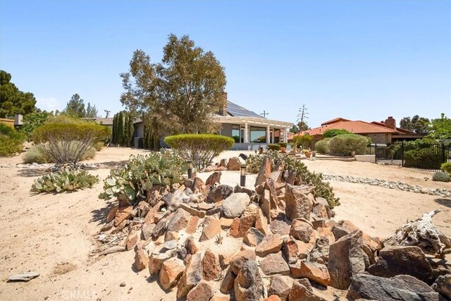 13784 Choco Rd, Apple Valley, CA 92307 - view of property hidden behind natural elements featuring solar panels