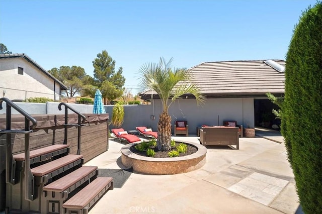 13784 Choco Rd, Apple Valley, CA 92307 - view of patio / terrace with outdoor lounge area, fence, and a hot tub