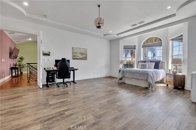 9371 Florence Ave, Downey, CA 90240 - bedroom with recessed lighting, wood finished floors, and a raised ceiling