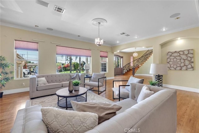 9371 Florence Ave, Downey, CA 90240 - living room featuring stairway, arched walkways, plenty of natural light, and visible vents