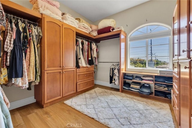 9371 Florence Ave, Downey, CA 90240 - walk in closet featuring light wood-type flooring