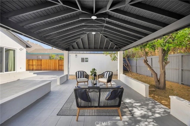view of patio featuring a fenced backyard and outdoor lounge area