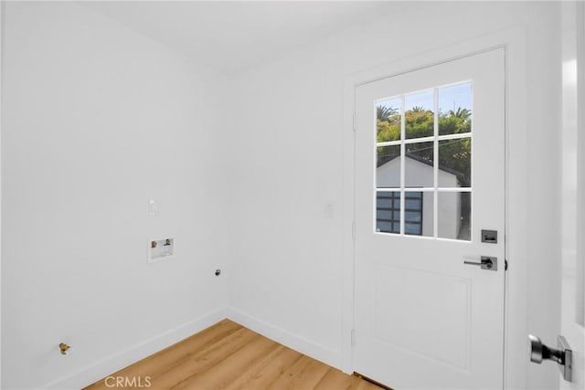interior space featuring baseboards and light wood-type flooring