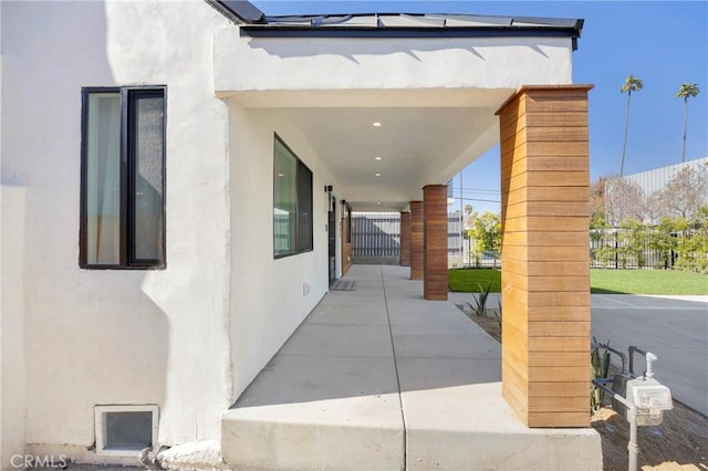 exterior space featuring fence and visible vents