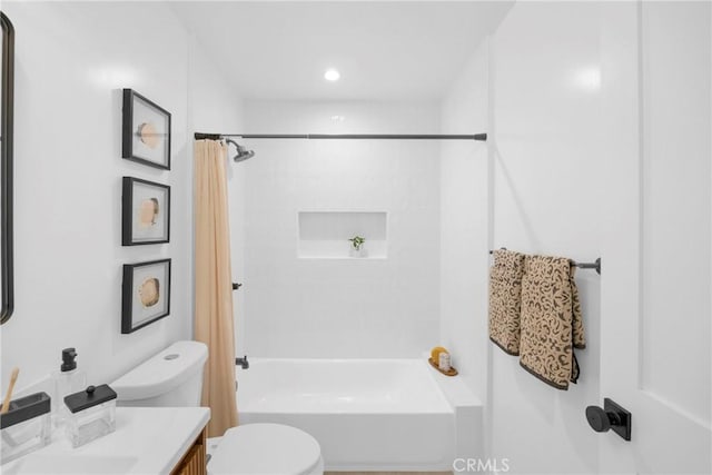 full bathroom with vanity, shower / bath combo, and toilet