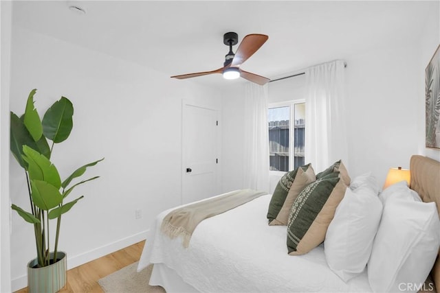 335 N Harvard Blvd, Los Angeles, CA 90004 - bedroom with wood finished floors and a ceiling fan