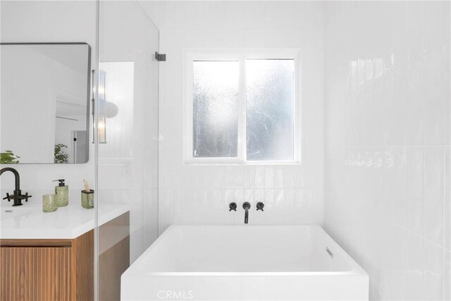 335 N Harvard Blvd, Los Angeles, CA 90004 - bathroom featuring a bath and vanity