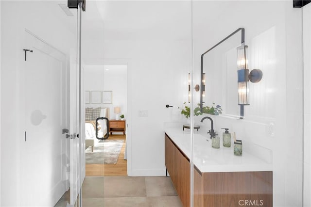 bathroom with vanity and baseboards
