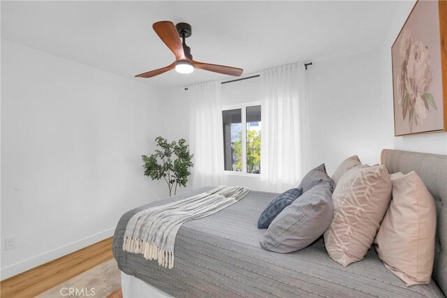 335 N Harvard Blvd, Los Angeles, CA 90004 - bedroom featuring light wood finished floors and ceiling fan