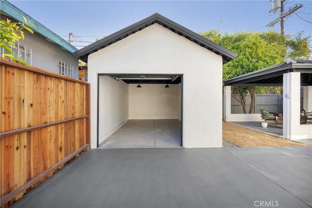 detached garage with fence