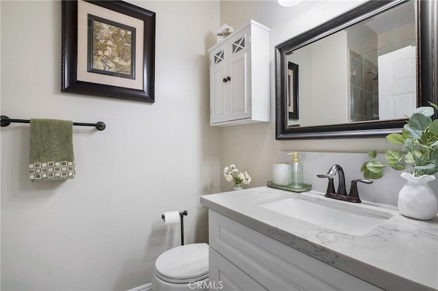 bathroom featuring toilet and vanity