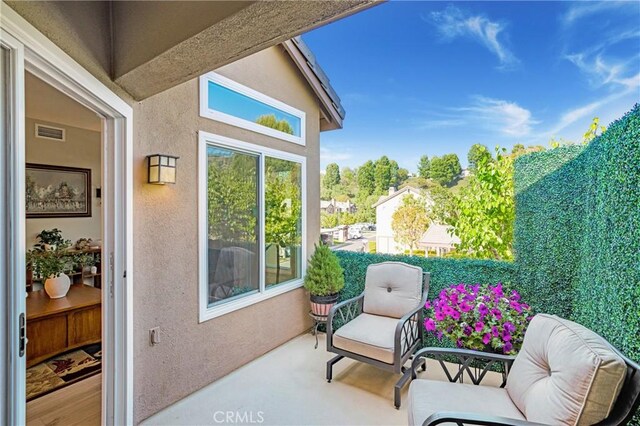 balcony featuring visible vents