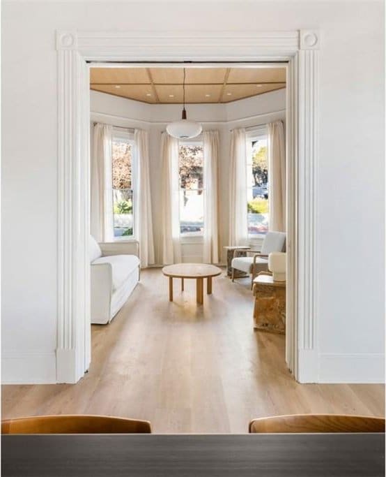 sitting room featuring wood finished floors and a wealth of natural light