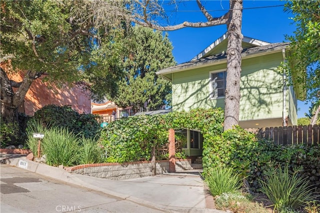 view of home's exterior with fence