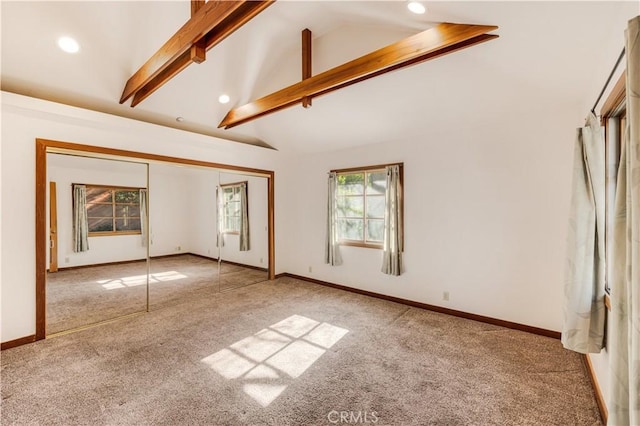 unfurnished bedroom featuring recessed lighting, baseboards, lofted ceiling with beams, and carpet