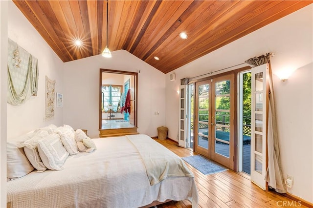 bedroom with access to outside, french doors, lofted ceiling, and light wood-style floors