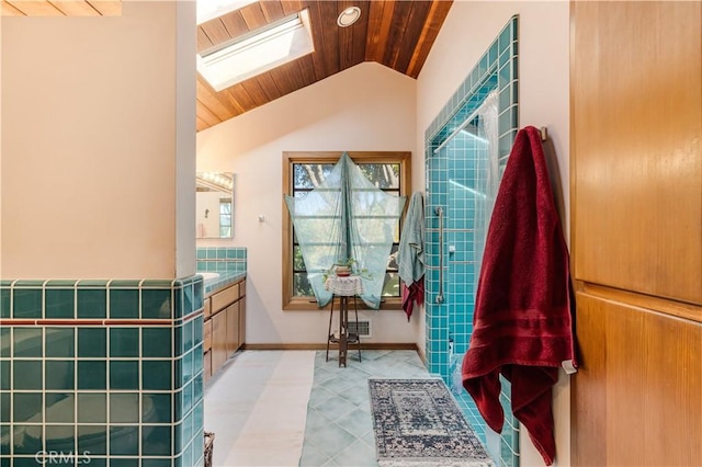 bathroom with visible vents, wood ceiling, vaulted ceiling with skylight, and vanity