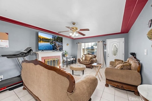 4185 E Turner Ave, Fresno, CA 93702 - living room featuring light tile patterned floors, a fireplace, and a ceiling fan