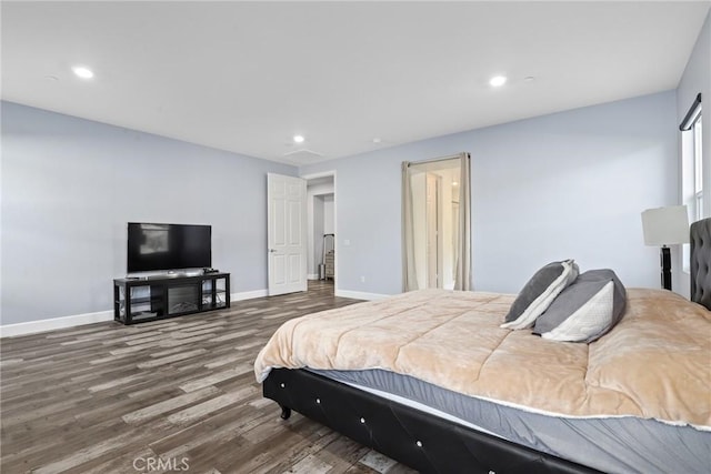bedroom with baseboards, recessed lighting, and wood finished floors