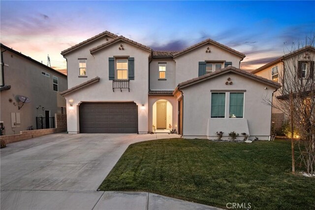 19183 Bension Dr, Saugus, CA 91350 - mediterranean / spanish-style home featuring a garage, driveway, a tile roof, stucco siding, and a yard