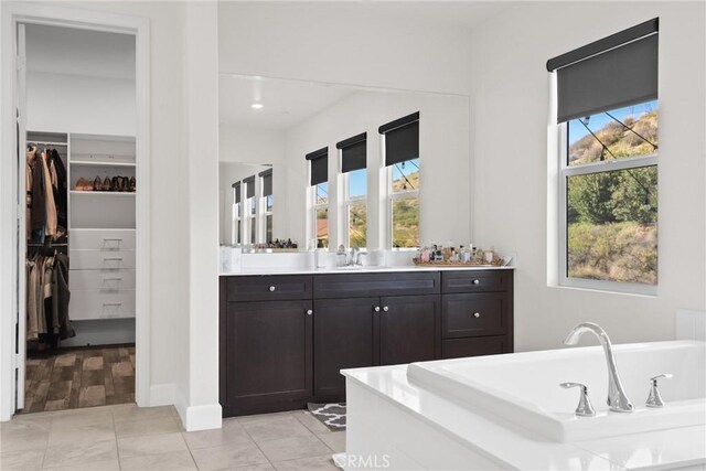 19183 Bension Dr, Saugus, CA 91350 - full bathroom featuring a soaking tub, a walk in closet, and vanity