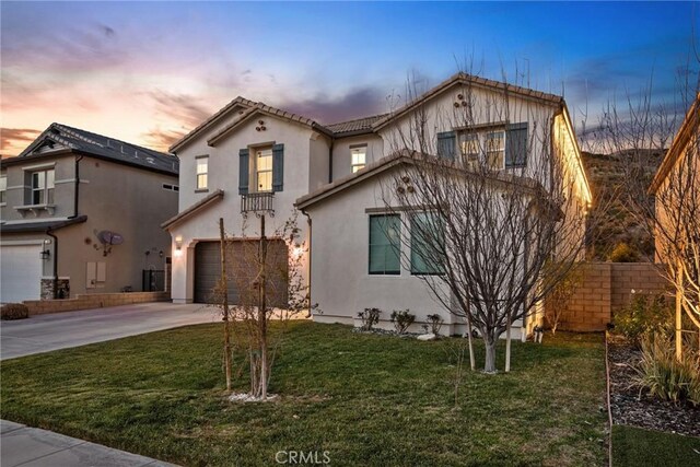 19183 Bension Dr, Saugus, CA 91350 - view of front of property featuring an attached garage, concrete driveway, a front lawn, and stucco siding