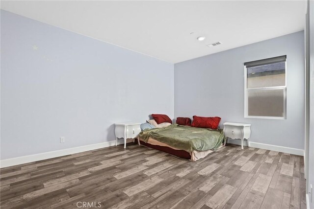 19183 Bension Dr, Saugus, CA 91350 - bedroom with wood finished floors and baseboards
