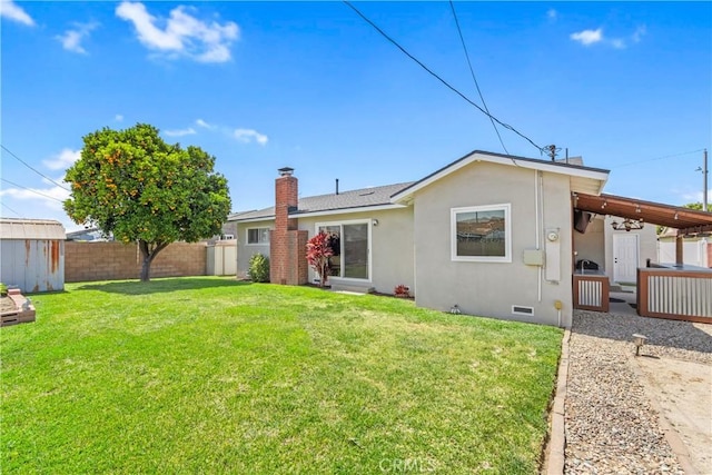 6222 Shawnee Rd, Westminster, CA 92683 - rear view of house with a storage shed, stucco siding, an outbuilding, and a chimney