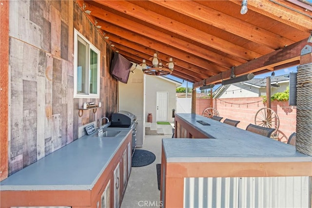 6222 Shawnee Rd, Westminster, CA 92683 - view of patio featuring exterior kitchen, a sink, and fence