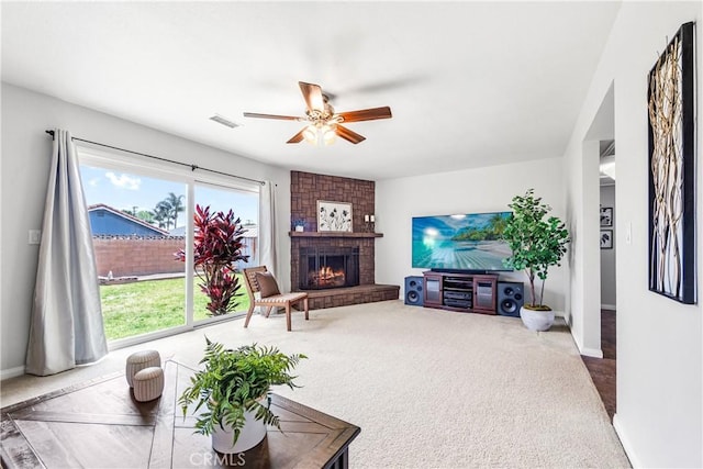 6222 Shawnee Rd, Westminster, CA 92683 - living area featuring carpet floors, a ceiling fan, baseboards, and a brick fireplace