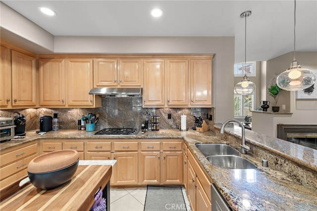 27 Birdie Ln, Coto De Caza, CA 92679 - kitchen with a sink, under cabinet range hood, light brown cabinets, and tasteful backsplash
