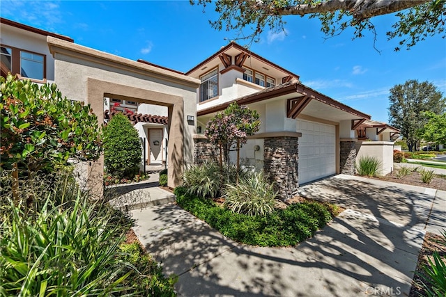 27 Birdie Ln, Coto De Caza, CA 92679 - mediterranean / spanish home with concrete driveway, a garage, stone siding, and stucco siding