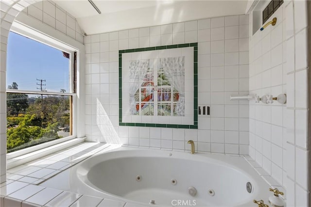 bathroom with a whirlpool tub