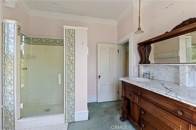 bathroom with crown molding, vanity, tasteful backsplash, and a shower stall