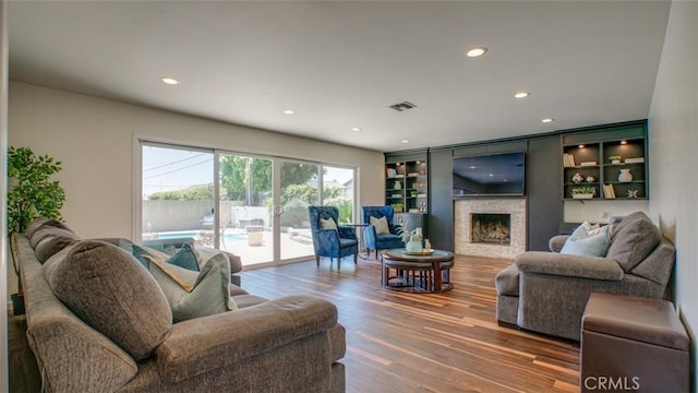 1090 Edgefield St, Upland, CA 91786 - living area featuring recessed lighting, wood finished floors, visible vents, and a fireplace