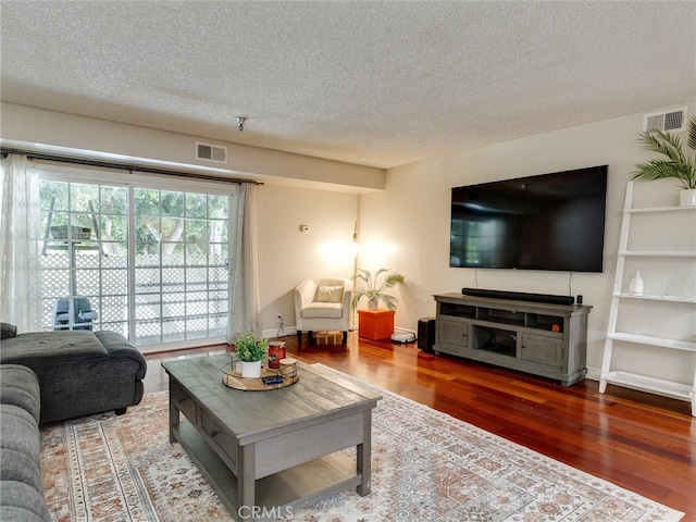 4142 E Mendez St Unit 331, Long Beach, CA 90815 - living area featuring wood finished floors and a textured ceiling