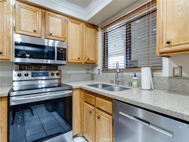 4142 E Mendez St Unit 331, Long Beach, CA 90815 - kitchen featuring stainless steel appliances, a sink, ornamental molding, tile patterned flooring, and light stone counters