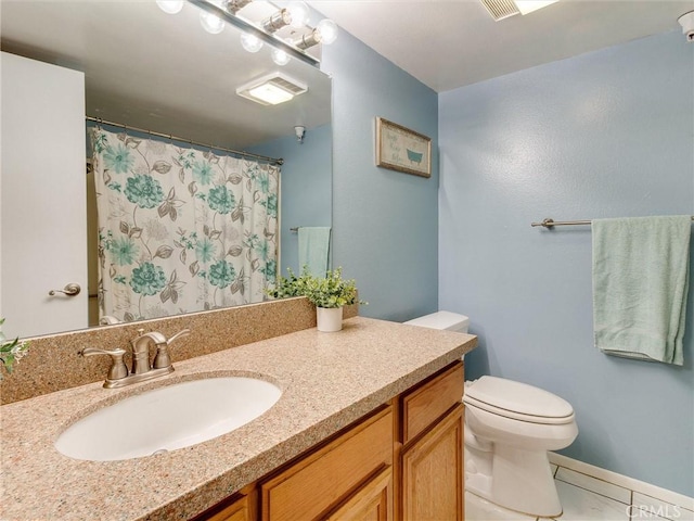 4142 E Mendez St Unit 331, Long Beach, CA 90815 - bathroom with toilet, vanity, and curtained shower