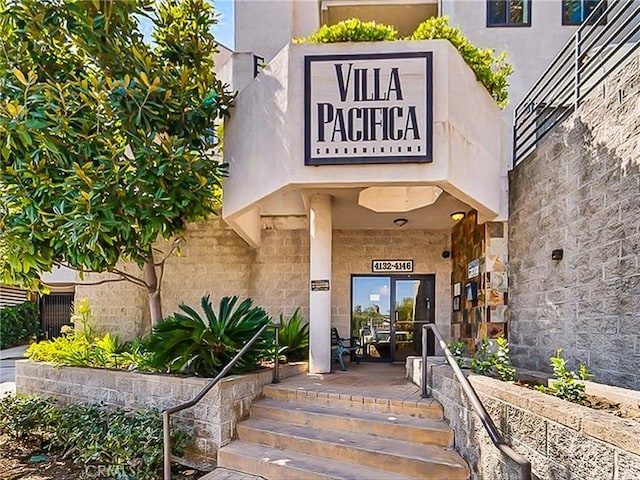4142 E Mendez St Unit 331, Long Beach, CA 90815 - doorway to property with stone siding