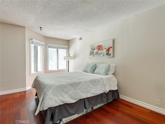 4142 E Mendez St Unit 331, Long Beach, CA 90815 - bedroom featuring baseboards, wood finished floors, and a textured ceiling
